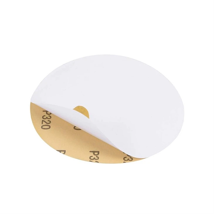 Adhesive abrasive discs